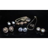 A 9ct gold chain hung with a gold plated locket, unmarked seed pearl brooch, white gold earrings etc