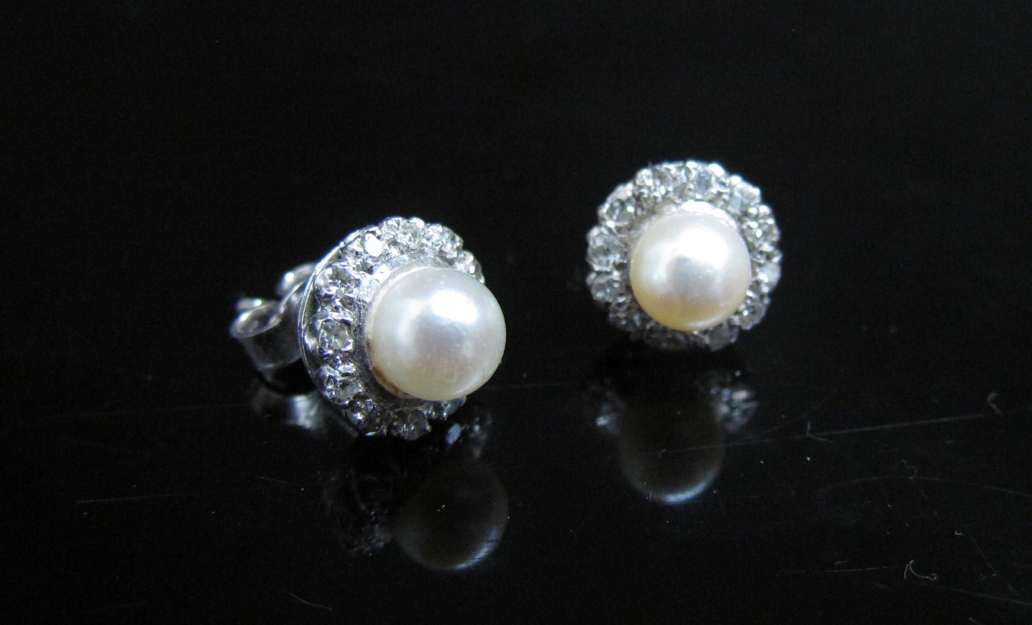 A pair of pearl and diamond earrings, the central pearl 5mm diameter framed by diamonds, for pierced - Image 3 of 3
