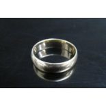 A 9ct gold wedding band. Size O/P, 2.9g