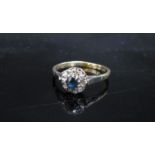 A 9ct gold sapphire and diamond cluster ring. Size R/S, 2.4g