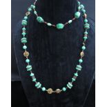 Two green bead necklaces with gilt spacers