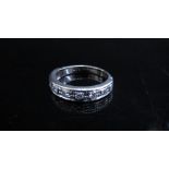 A white gold half hoop diamond ring, stamped 18ct. Size N, 4.5g