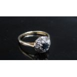 An 18ct gold sapphire and diamond cluster ring. Size N, 2.9g
