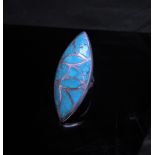 A Hopi Native American Indian turquoise ring of lozenge form, 4cm long. Size Q/R, stamped LS