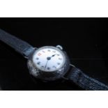 A silver cased lady's wristwatch, Swiss movement, on leather strap