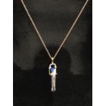 A crystal wand pendant set with diamond chips, hung on chain stamped 375, 56cm long, 1g chain