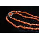 A double strand coral bead necklace, 53cm long
