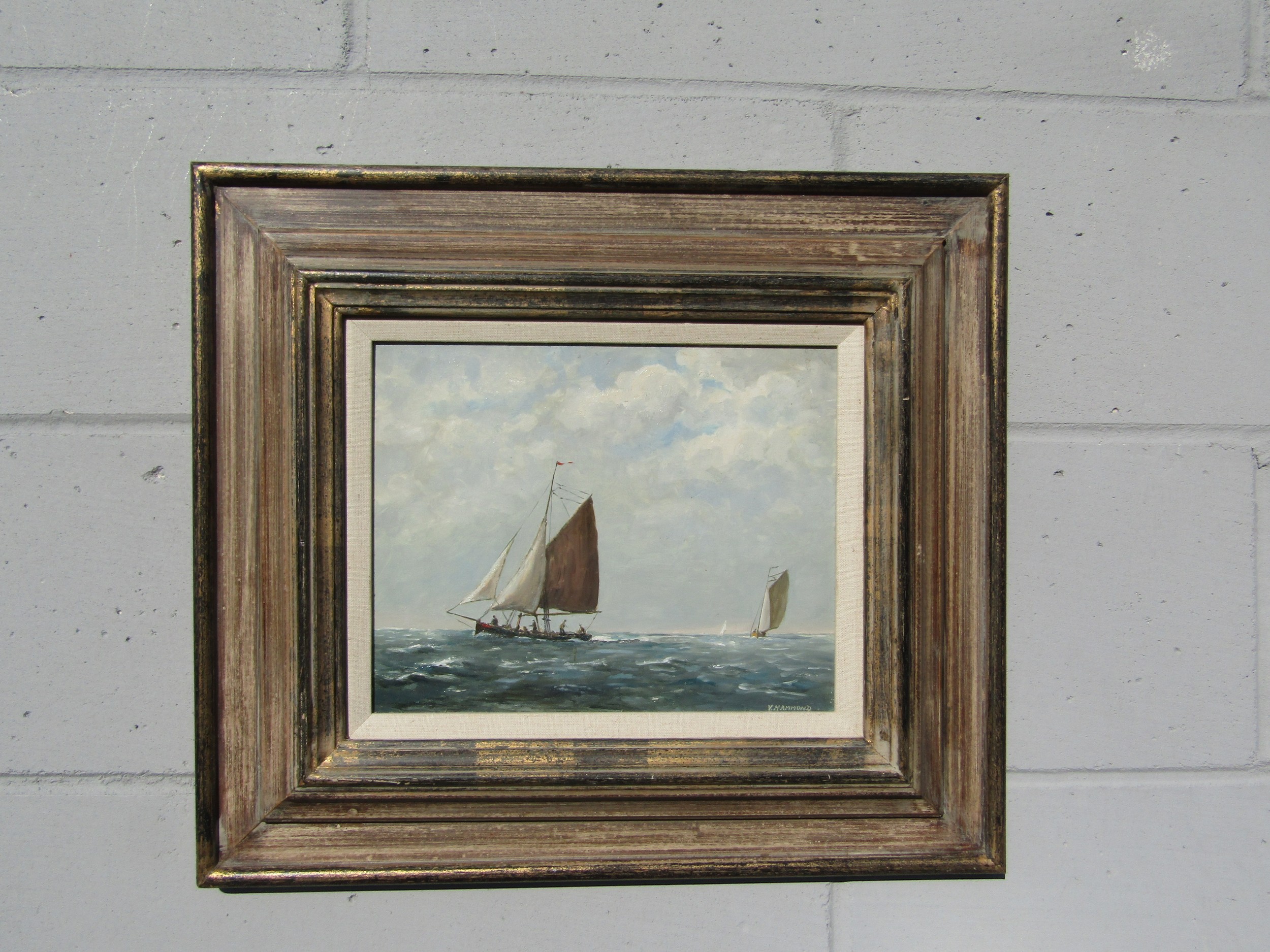 ALFRED VAVASOUR HAMMOND (1900-1985): A framed oil on board of sailing boats. Signed bottom right.