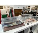 Five models of ships in display cases