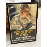 A framed and glazed National Savings poster “LEND TO DEFEND HIS RIGHT TO BE FREE: BUY NATIONAL