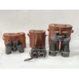 Three pairs of WWII British binoculars with leather cases