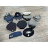 Two boxes of mixed headwear and webbing including post war British and German