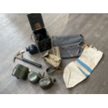 A box of miscellaneous including 1938 pattern canteen, water bottles and escape axe etc