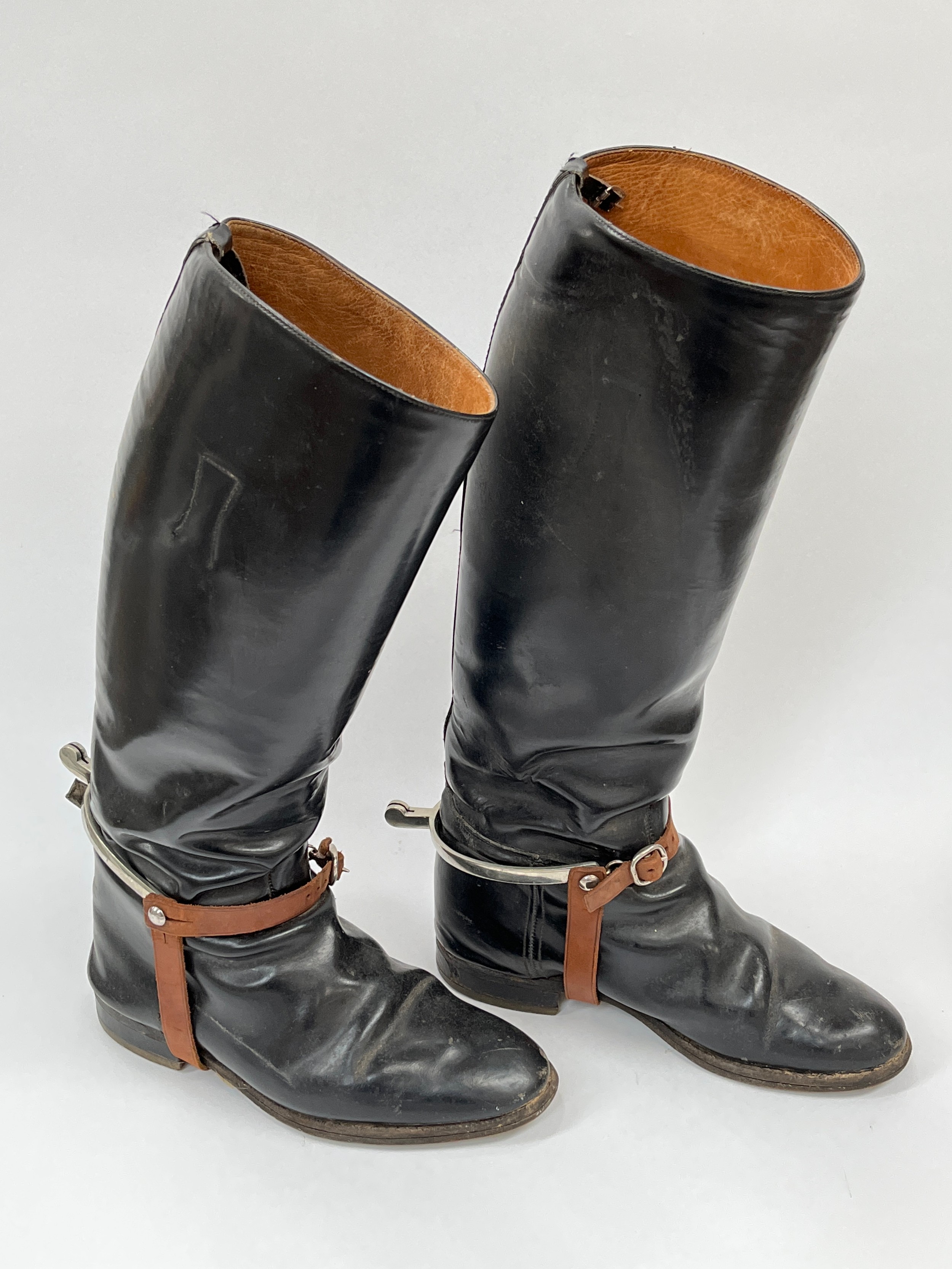 A pair of officer's black leather cavalry boots with spurs