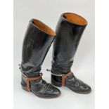 A pair of officer's black leather cavalry boots with spurs