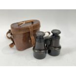 A pair of early 20th Century J.H. Steward of Strand, London binoculars, marked US with anchor and