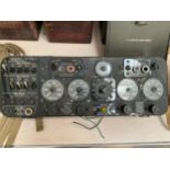 A mid 20th Century Aircraft electrical control panel with generator dials