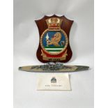 An HMS Vanguard crest together with a souvenir book and model (3)