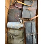 A box of mixed militaria including WWI and 1944 pattern pouches, holster etc