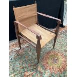 An early to mid 20th Century campaign canvas and leather armchair