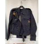 A post war Civil Defence uniform including jacket with Civil Defence breast badge and headquarters