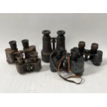 Five pairs of various binoculars, no cases