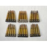 A quantity of Lee Enfield .303 cartridges with clips