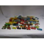 A collection of assorted playworn diecast vehicles including Dinky Alvis tank, Corgi Aston Martin