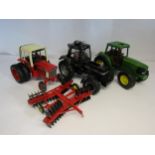 Three unboxed diecast 1:16 scale diecast tractors comprising Universal Hobbies Case IH 1455XL and