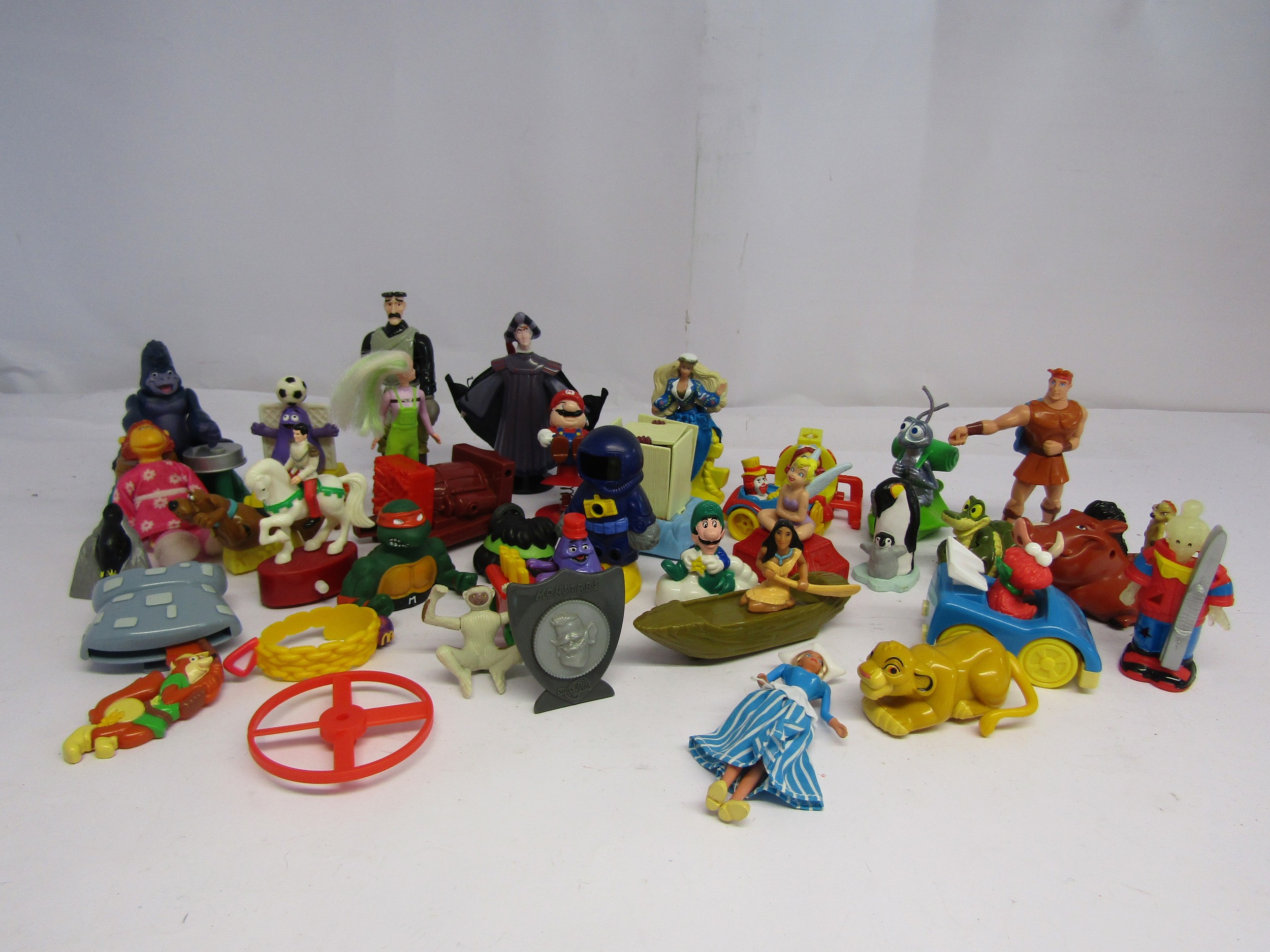 A collection of McDonalds Happy Meal plastic toys