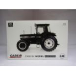 A boxed Universal Hobbies 1:16 scale Case IH 1455XL Black Edition Tractor, from a limited edition of
