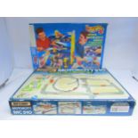 A Mattel Hot Wheels Deluxe Auto-City Garage playset and Matchbox Motorcity MC 510 playset (2,