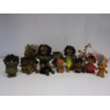 A collection wooden and plastic model trolls including Nyform and Heico examples