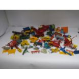 A collection of loose playworn Britains farm issue diecast and plastic vehicles, implements and