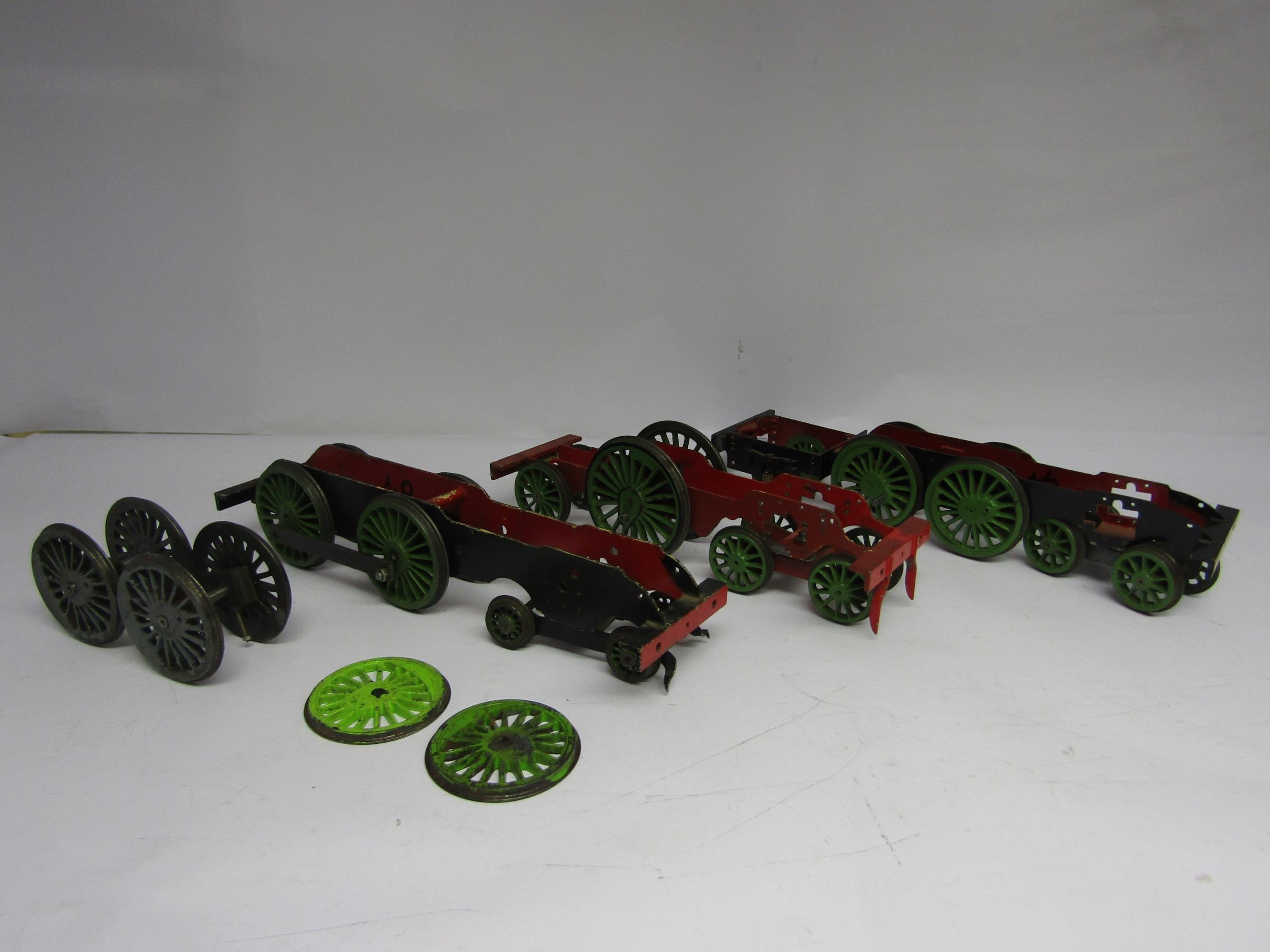 Three gauge 1 model railway locomotive wheelbases together with two pairs of wheels on axles and