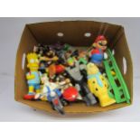 A box of film and catoon character plastic figures including Bart Simpson, Super Mario, Wallace
