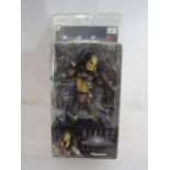 A sealed Aliens Vs Predator plastic action figure by Neca Reel Toys