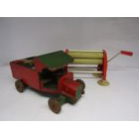 A vintage painted wooden truck with brick load and a Ken Roy "Wringerette" child's mangle (2)