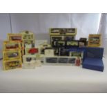 A collection of boxed Lledo diecast vehicles and multi-pack sets including Co-op Dairy Millenium