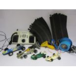 Two playworn Scalextric Yardley B.R.M. Formula 1 slot racing cars and a quantity of track and