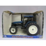 A boxed ERTL 1:16 scale diecast 13577 New Holland TM165 Tractor