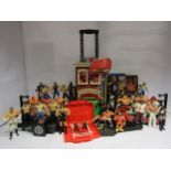 A collection of mostly WWE wrestling action figures, two wrestling rings and other accessories,
