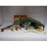 A constructed Britains 1:32 scale farm building with 40973 Farm Buildings Set box and assorted loose