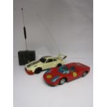 A Bandai, Japan, Porsche Carrera metal and plastic model car and an Entex Electronics radio