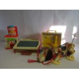 Four vintage Fisher Price toys to include Snoopy pull along dog, School Days desk, Jack In The Box