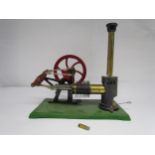 A Robin Reichelt hot air powered single cylinder stationary engine with cast iron flywheel and brass