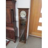 A 20th Century oak cased Synchromonic electric master clock with pendulum