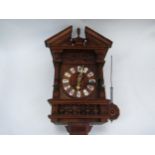 A late 19th early 20th Century German Cuckoo clock with spring driven movement in unusual wooden