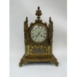 A 19th Century brass cased bracket clock of architectural design, painted metal convex Roman dial