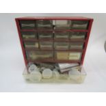 A large collection of watch/clock fixings and spares in various multi drawer cabinets including